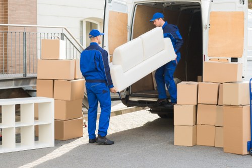 Packed boxes and furniture ready for loading during a Hackney removal
