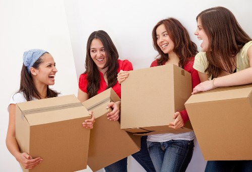 Packed moving boxes and furniture ready for a Hackney home removal