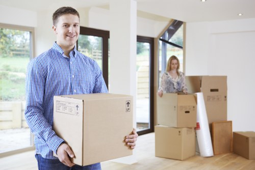 Packed moving boxes and furniture ready for transport in Hackney