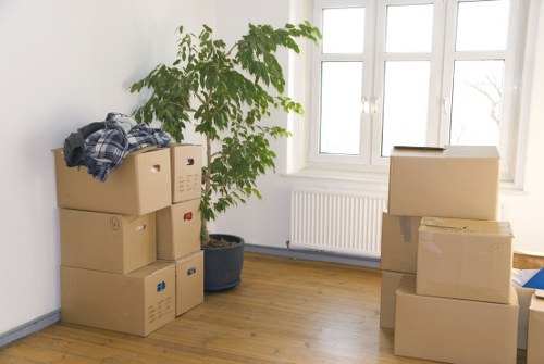 Furniture and boxes being loaded into a moving truck in East London