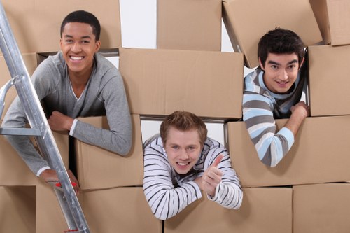 Office moving team transporting desks and IT equipment