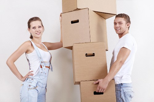 Packed office boxes and labelled furniture ready for relocation